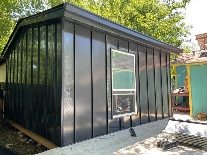 Black standing seam metal wall panels for Metal Roof Installation in Elm Grove