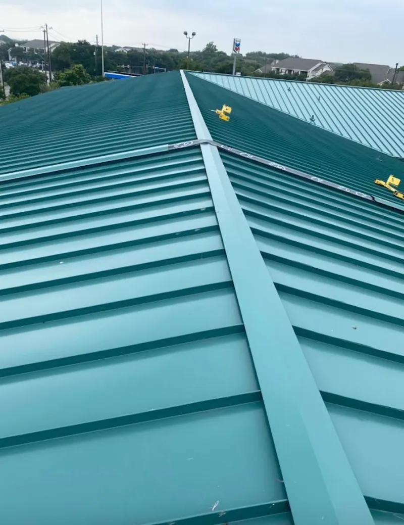 Green commercial metal roof ridge and valley for Metal Roof Repair in Elm Grove